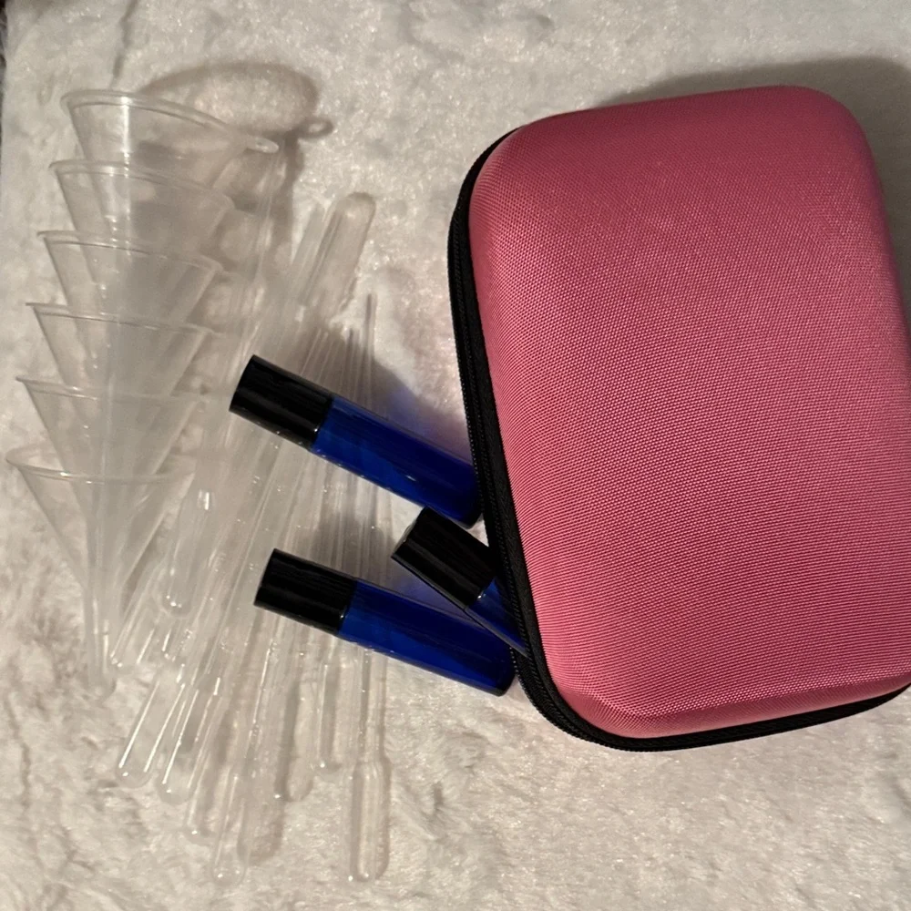 Pink and Black Travel Case with 12 Blue Roll On Bottles with Funnels Pipettes